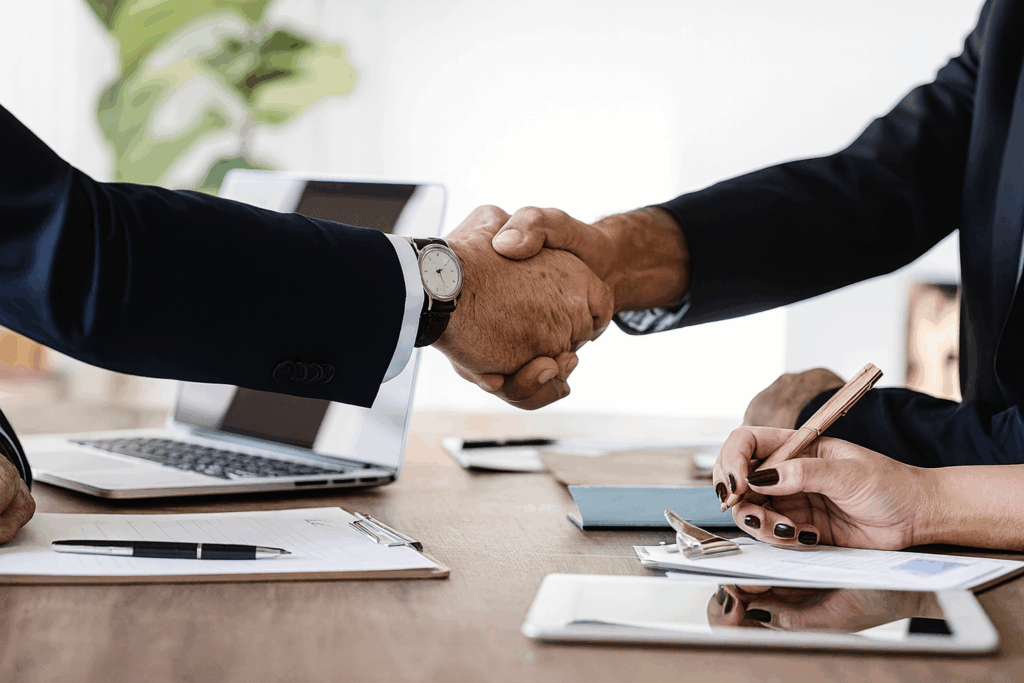 Professional business handshake between client and Custom Home Builders in Edmonton, ConstructionX, symbolizing trust and collaboration.