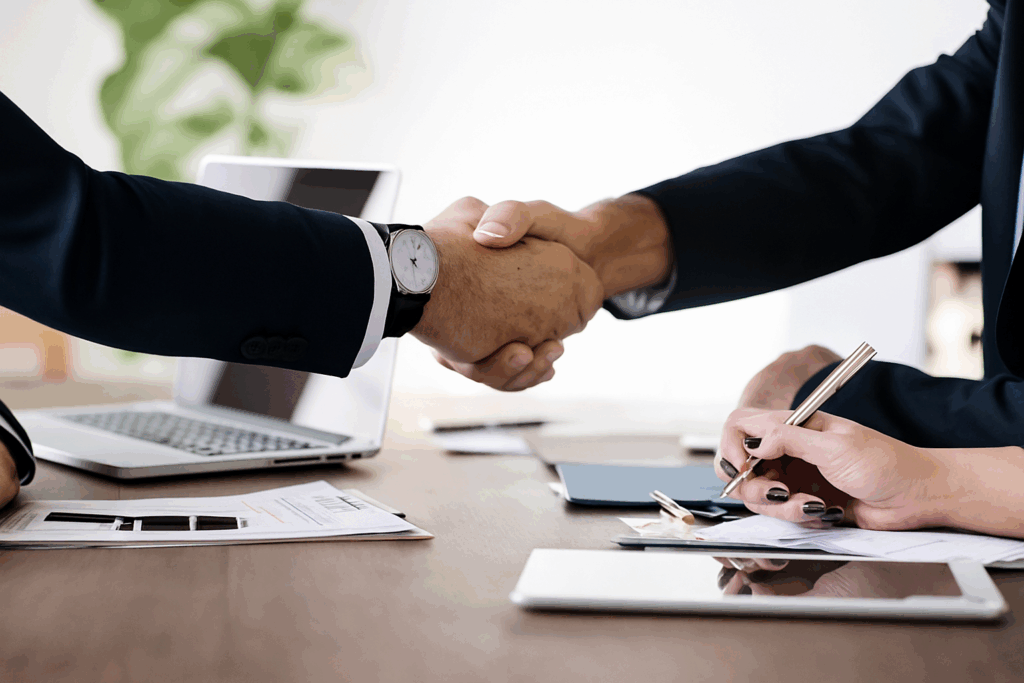 Professional handshake at business meeting — ConstructionX, Custom Home Builders in Lethbridge